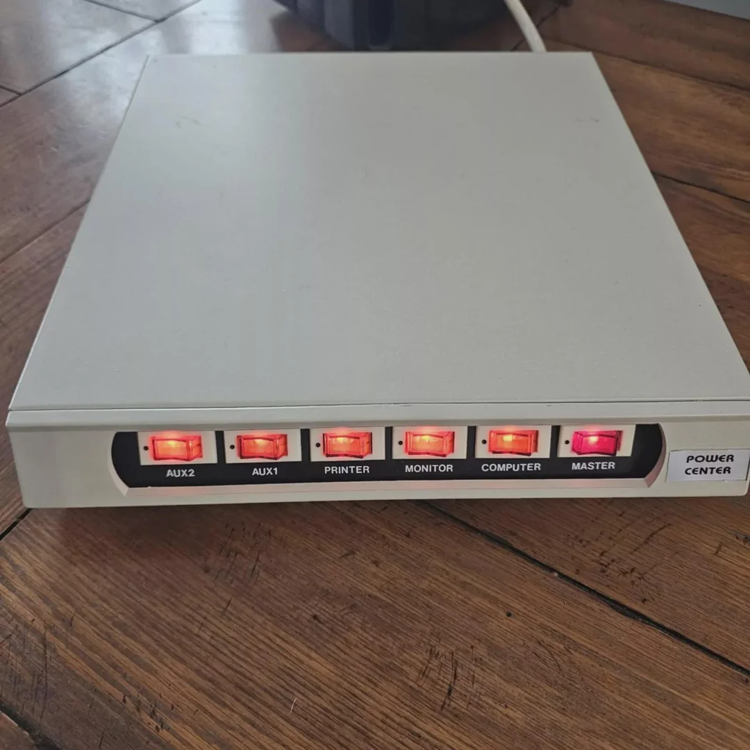 A Power Center surge protector, designed to be used underneath a CRT monitor